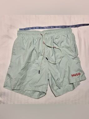 HUGO Light Mint Green Swim Shorts with Red Logo